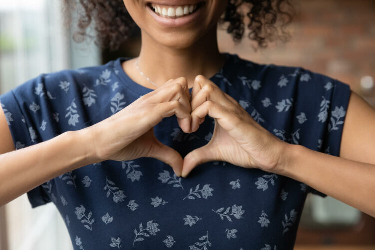 Woman making a heart with her hands