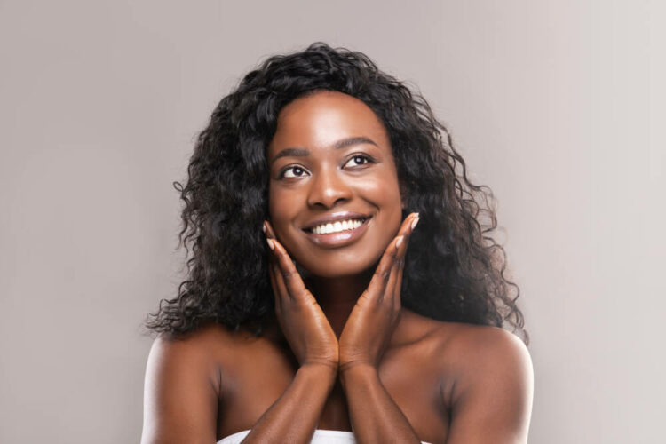 Woman touching her smooth face