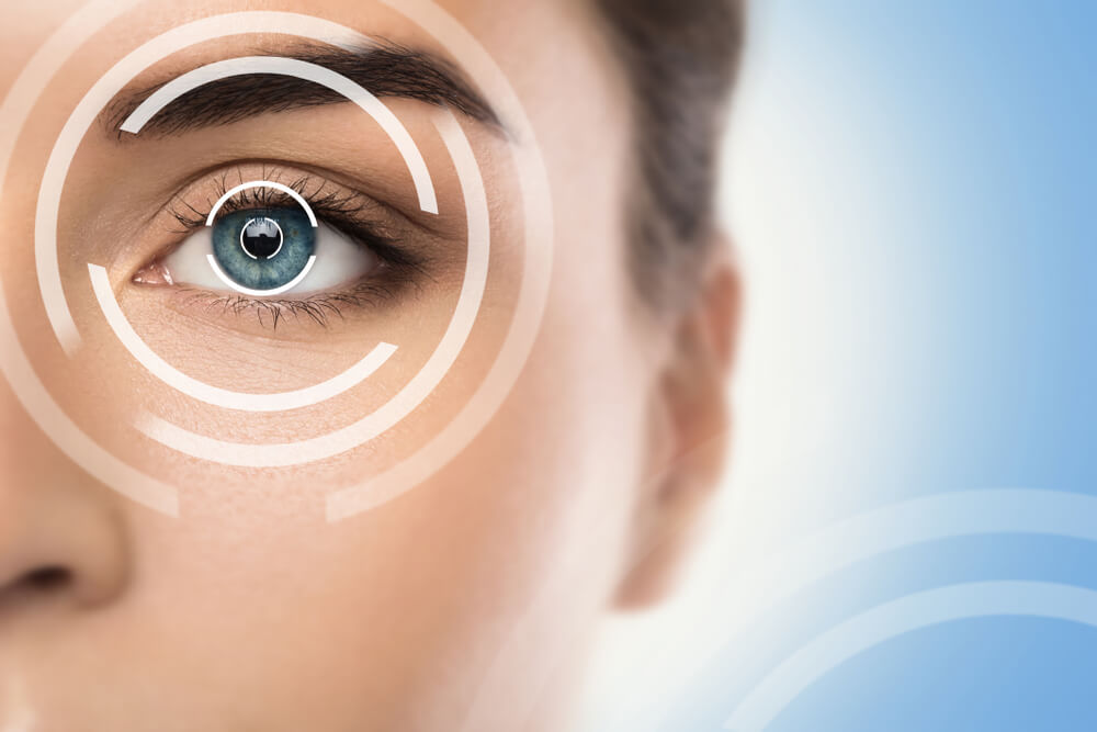 Woman with graphics over her eye depicting technology