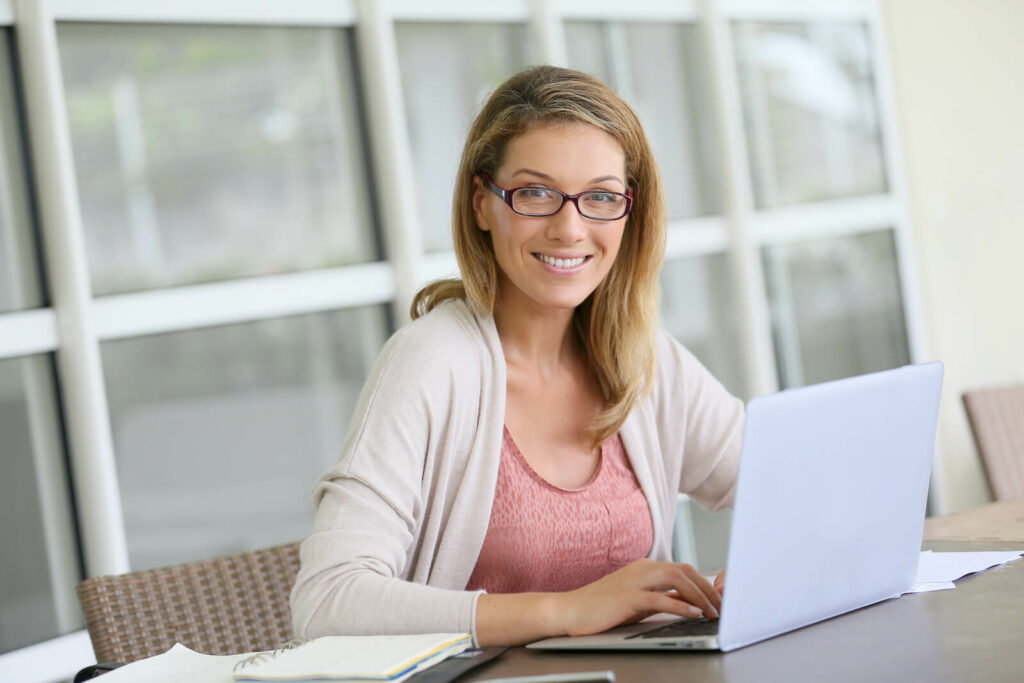 Middle-aged woman working from home on laptop